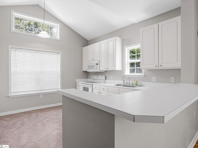 kitchen with white appliances, a sink, light countertops, baseboards, and lofted ceiling