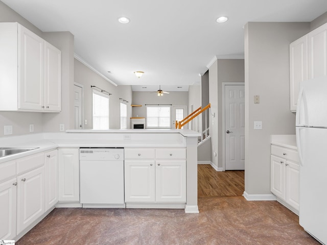 kitchen with white appliances, ceiling fan, a peninsula, recessed lighting, and crown molding