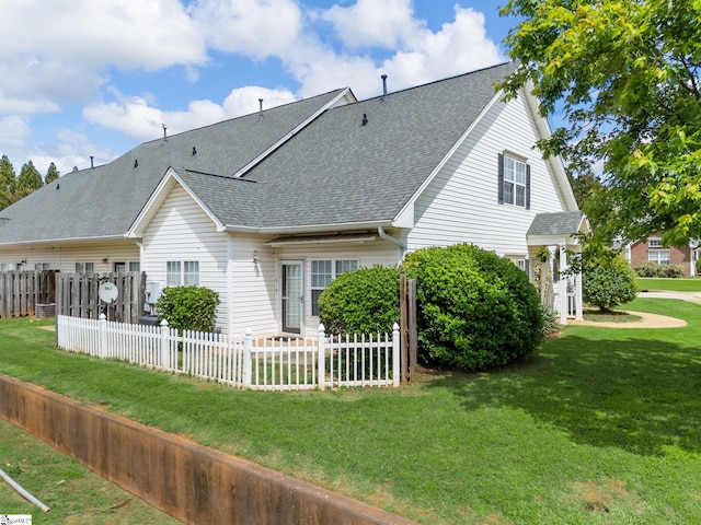 back of property featuring roof with shingles