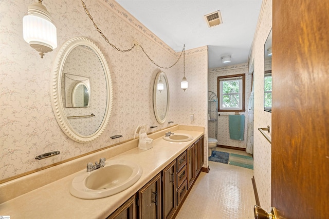 11 Crestview Ct, Piedmont, SC 29673 - full bathroom with wallpapered walls, toilet, and double vanity
