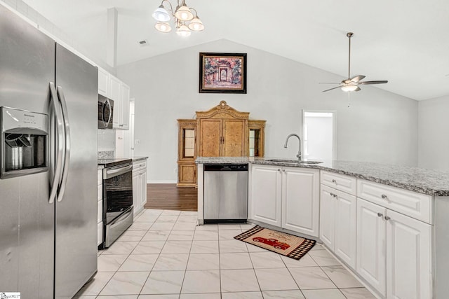 1105 Autumn Leaf Ln, Fountain Inn, SC 29644 - kitchen with appliances with stainless steel finishes, a sink, lofted ceiling, light marble finish flooring, and ceiling fan