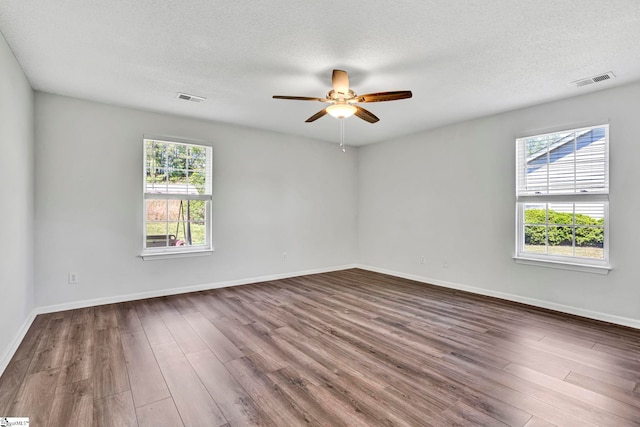 1105 Autumn Leaf Ln, Fountain Inn, SC 29644 - unfurnished room featuring a ceiling fan, wood finished floors, baseboards, and a textured ceiling