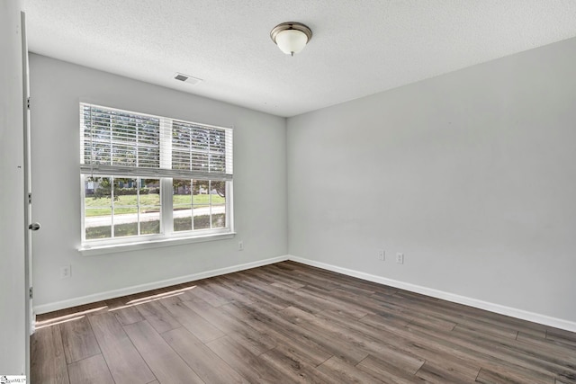 1105 Autumn Leaf Ln, Fountain Inn, SC 29644 - unfurnished room with wood finished floors, a textured ceiling, and baseboards