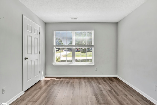 1105 Autumn Leaf Ln, Fountain Inn, SC 29644 - unfurnished bedroom with wood finished floors, a textured ceiling, and baseboards