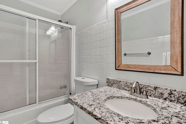 1105 Autumn Leaf Ln, Fountain Inn, SC 29644 - bathroom with tile walls, ornamental molding, toilet, vanity, and bath / shower combo with glass door