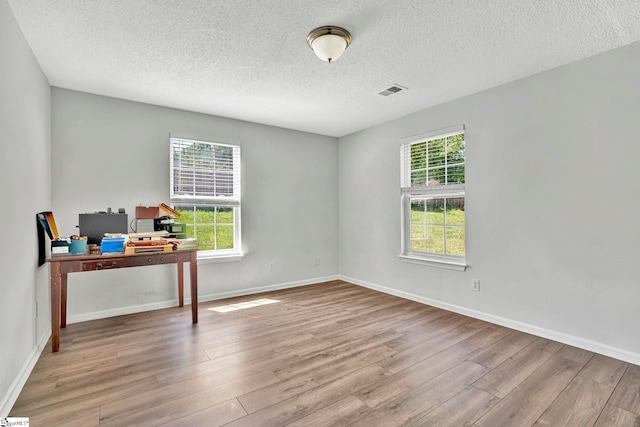 1105 Autumn Leaf Ln, Fountain Inn, SC 29644 - unfurnished office with wood finished floors, a textured ceiling, and baseboards
