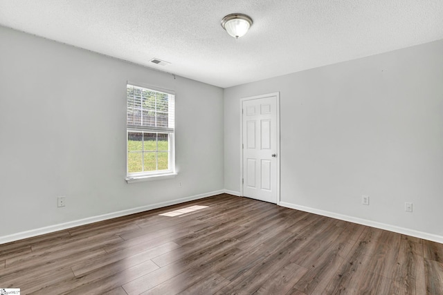 1105 Autumn Leaf Ln, Fountain Inn, SC 29644 - spare room featuring wood finished floors, a textured ceiling, and baseboards