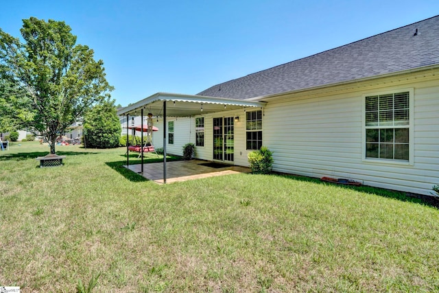 1105 Autumn Leaf Ln, Fountain Inn, SC 29644 - back of house with a patio area, a shingled roof, and a lawn
