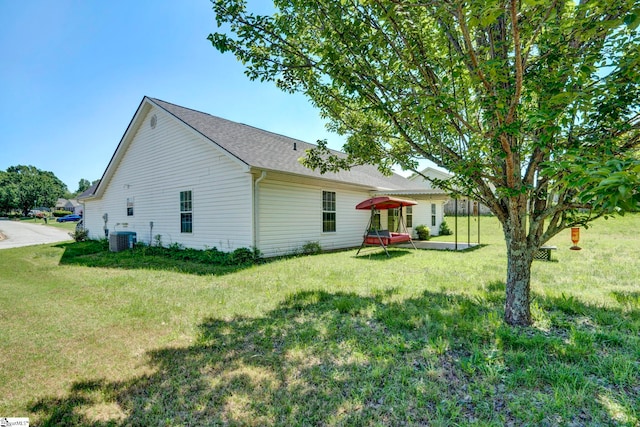 1105 Autumn Leaf Ln, Fountain Inn, SC 29644 - back of property featuring cooling unit, a yard, and roof with shingles