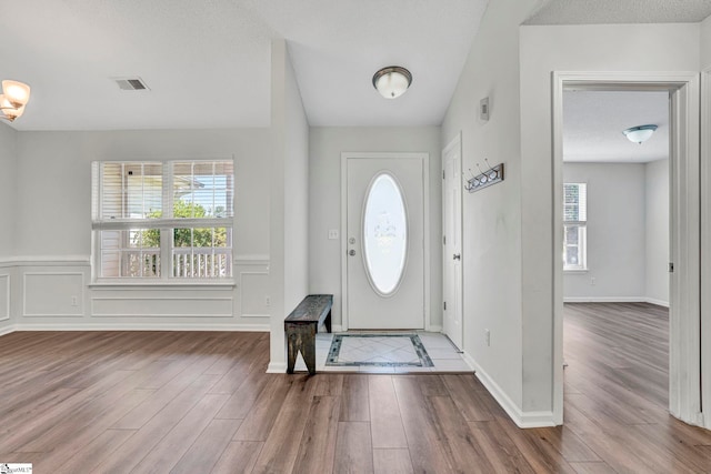 1105 Autumn Leaf Ln, Fountain Inn, SC 29644 - foyer featuring wood finished floors and wainscoting