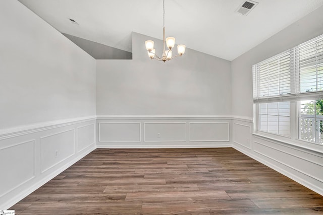 1105 Autumn Leaf Ln, Fountain Inn, SC 29644 - empty room with vaulted ceiling, a chandelier, a wainscoted wall, dark wood-style floors, and a decorative wall