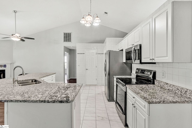 1105 Autumn Leaf Ln, Fountain Inn, SC 29644 - kitchen with appliances with stainless steel finishes, a sink, a ceiling fan, light marble finish flooring, and white cabinets