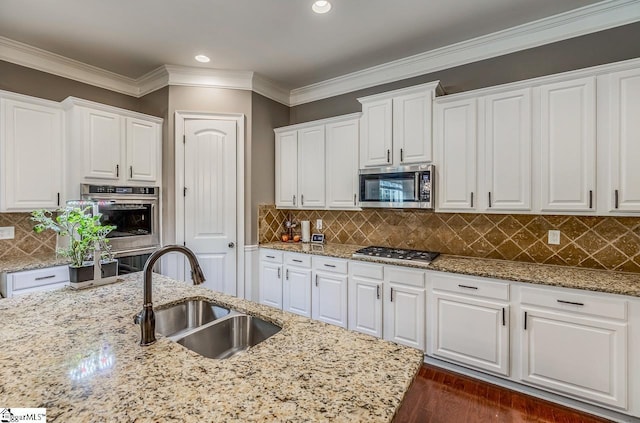 112 Murdock Ln, Greer, SC 29651 - kitchen with stainless steel appliances, a sink, white cabinetry, crown molding, and recessed lighting
