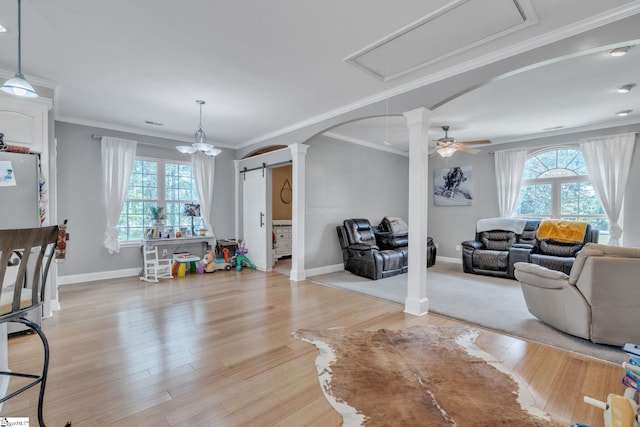317 Hunter Rd, Fountain Inn, SC 29644 - living room with decorative columns, arched walkways, baseboards, ornamental molding, and ceiling fan