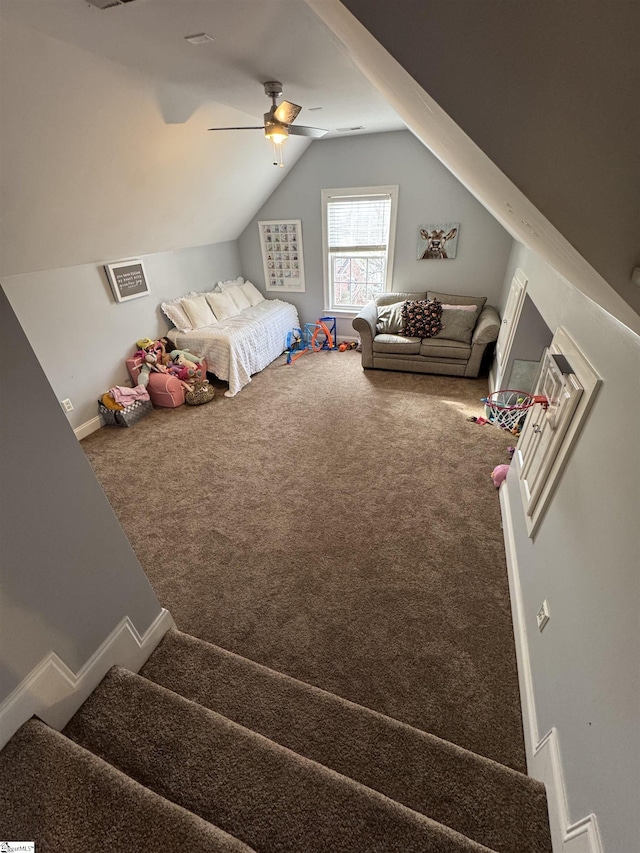 carpeted bedroom featuring lofted ceiling and a ceiling fan