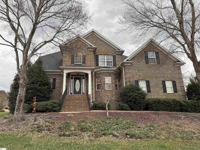 traditional-style house with brick siding