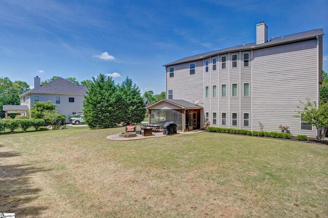 9 Bellagio Way, Greer, SC 29650 - back of house with a chimney, a yard, a patio, and a gazebo