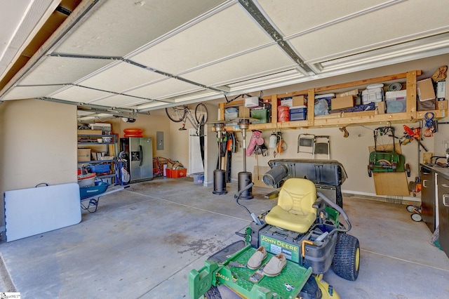 9 Bellagio Way, Greer, SC 29650 - garage with stainless steel fridge with ice dispenser and electric panel
