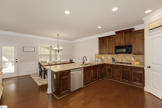 9 Bellagio Way, Greer, SC 29650 - kitchen with appliances with stainless steel finishes, a sink, dark wood-style floors, a chandelier, and a peninsula