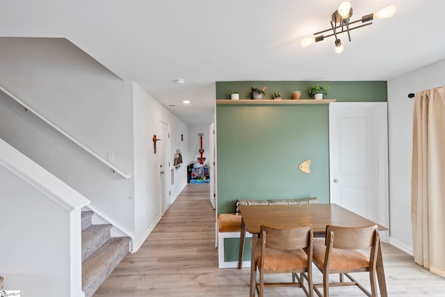 dining area with stairs, light wood-style flooring, recessed lighting, and baseboards