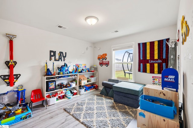 game room with wood finished floors