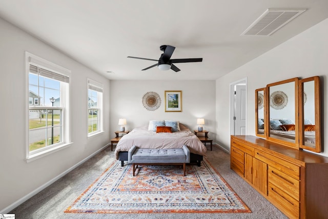 bedroom with light carpet, baseboards, and ceiling fan