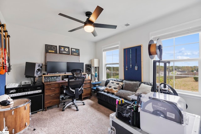office area with carpet floors and a ceiling fan