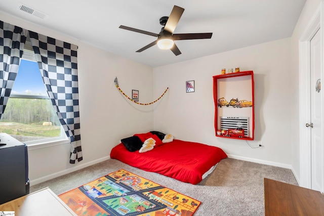 bedroom featuring carpet floors, baseboards, and ceiling fan