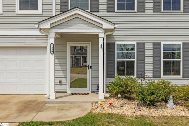 property entrance with an attached garage