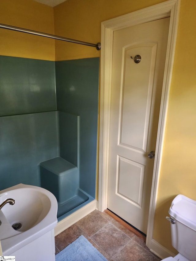 199 Ccc Camp Rd, Greer, SC 29651 - bathroom featuring a shower stall, baseboards, and toilet