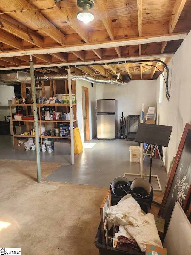 199 Ccc Camp Rd, Greer, SC 29651 - unfinished basement featuring freestanding refrigerator and concrete block wall