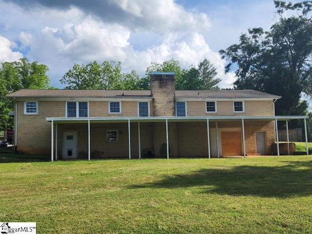 199 Ccc Camp Rd, Greer, SC 29651 - back of property featuring a yard, brick siding, and a chimney