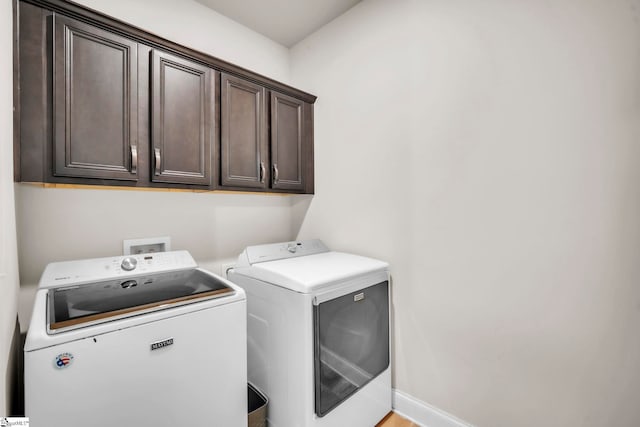 549 Allenton Way, Greer, SC 29651 - laundry room featuring washing machine and dryer, cabinet space, and baseboards