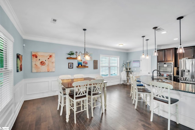 549 Allenton Way, Greer, SC 29651 - dining room with dark wood-type flooring, a wainscoted wall, crown molding, a chandelier, and recessed lighting
