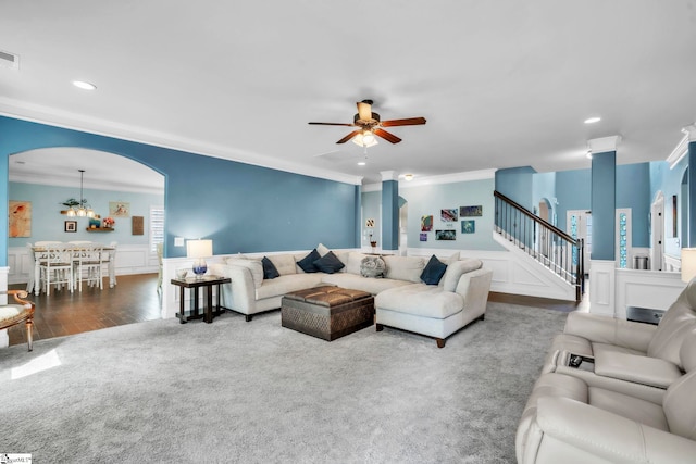 549 Allenton Way, Greer, SC 29651 - living room with crown molding, carpet floors, ceiling fan, a wainscoted wall, and stairs