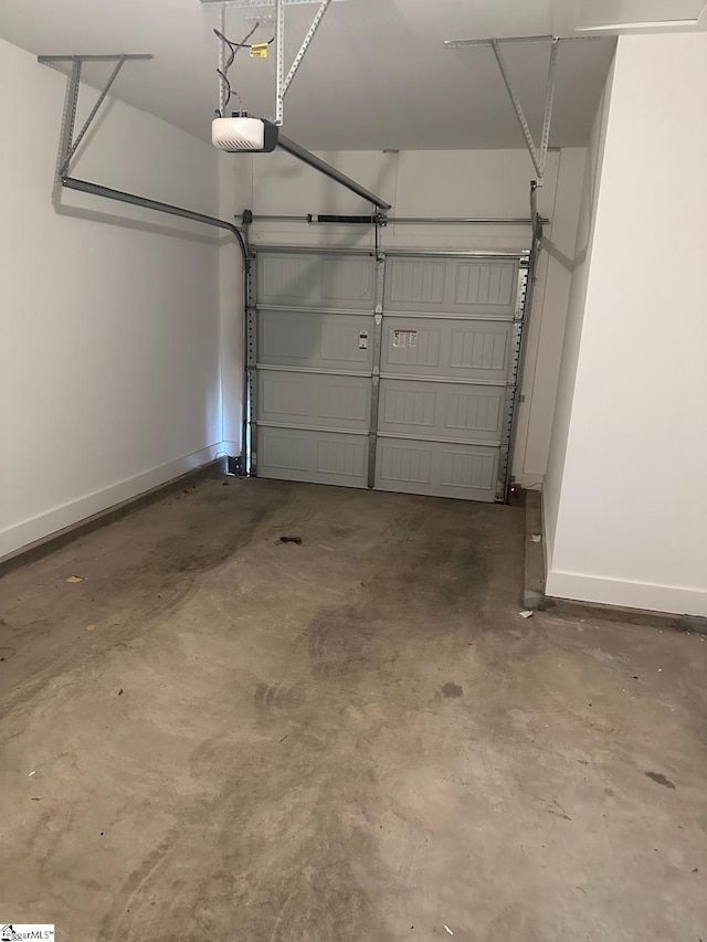 234 Woodhouse Way # 1, Greenville, SC 29605 - garage featuring a garage door opener and baseboards