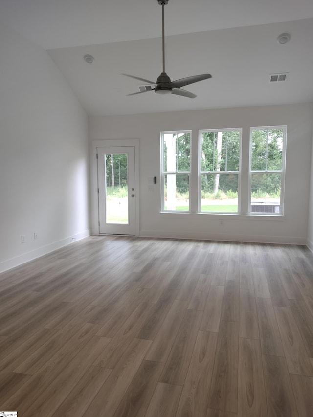 234 Woodhouse Way # 1, Greenville, SC 29605 - unfurnished living room with ceiling fan, wood finished floors, vaulted ceiling, and baseboards