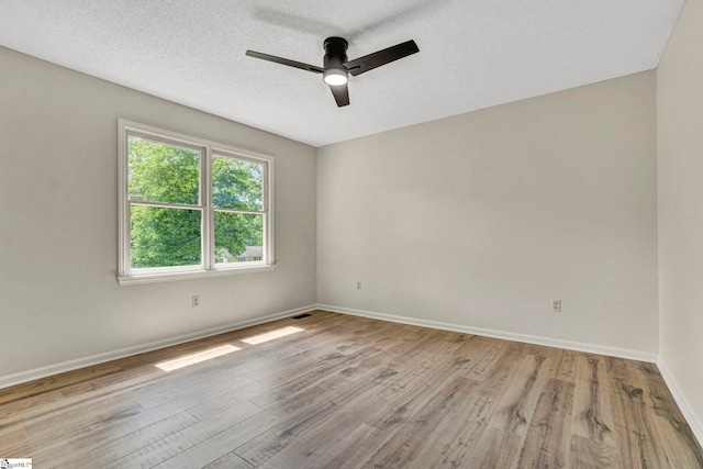 167 Lake Bowen Dr, Inman, SC 29349 - empty room with ceiling fan, wood finished floors, baseboards, and a textured ceiling