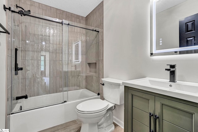 167 Lake Bowen Dr, Inman, SC 29349 - full bathroom with a textured ceiling, toilet, bath / shower combo with glass door, and vanity