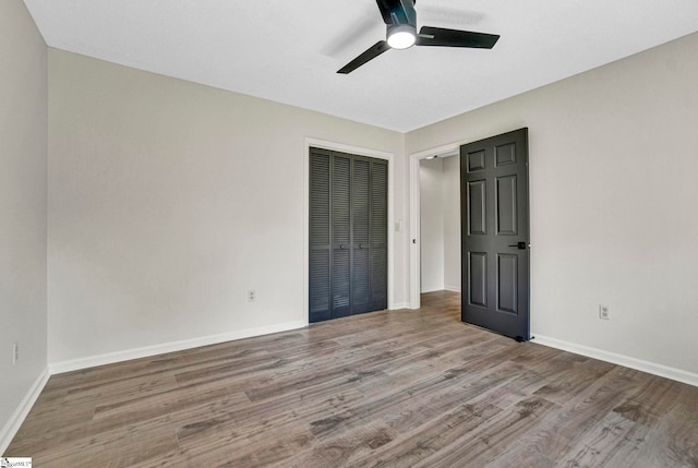 167 Lake Bowen Dr, Inman, SC 29349 - unfurnished bedroom with wood finished floors, a closet, baseboards, and a ceiling fan