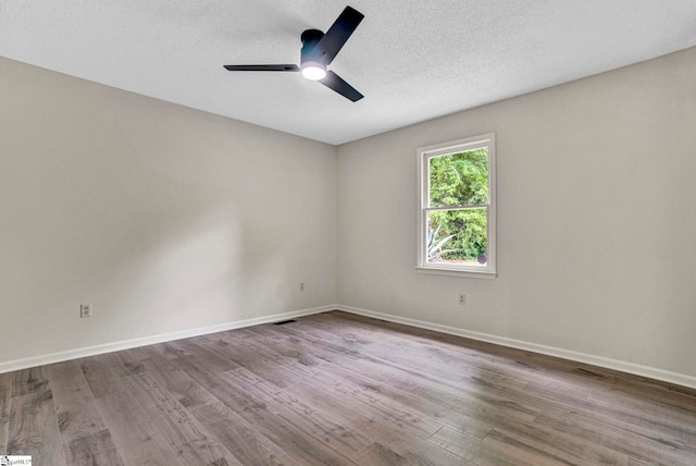 167 Lake Bowen Dr, Inman, SC 29349 - unfurnished room with wood finished floors, a ceiling fan, baseboards, and a textured ceiling