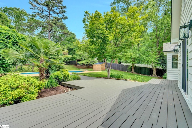 167 Lake Bowen Dr, Inman, SC 29349 - deck featuring a storage unit, an outdoor structure, and a fenced backyard