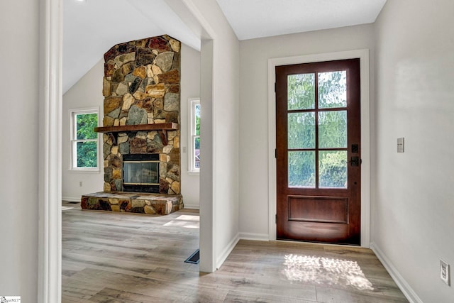 167 Lake Bowen Dr, Inman, SC 29349 - foyer with wood finished floors, a stone fireplace, vaulted ceiling, and baseboards