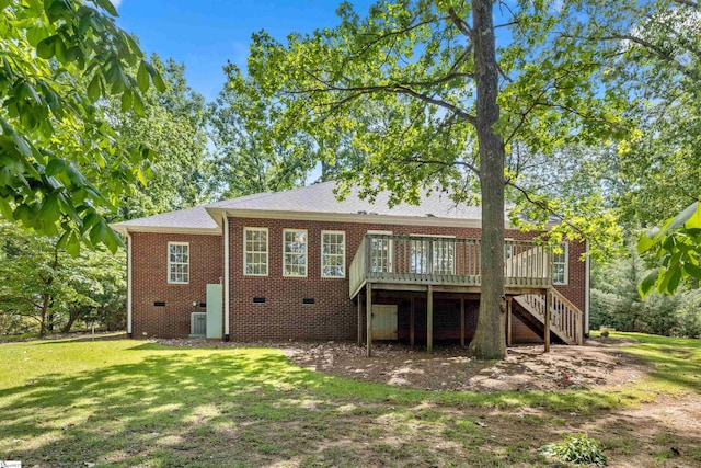 back of house featuring stairs, a wooden deck, a yard, crawl space, and brick siding