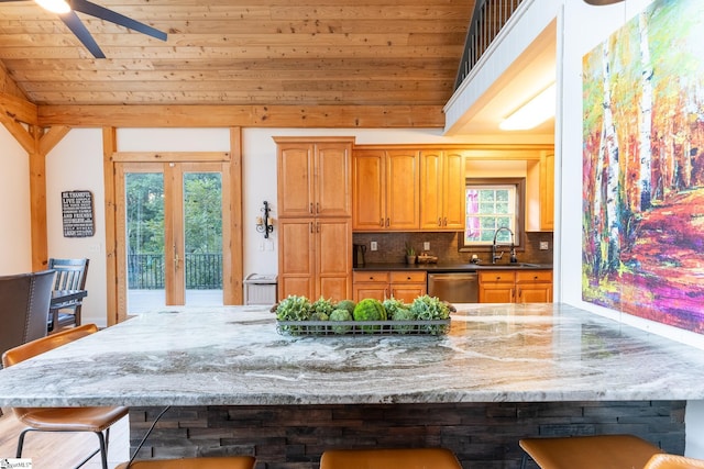 122 Fair Heaven Ct, Seneca, SC 29672 - kitchen featuring dishwasher, a breakfast bar area, french doors, lofted ceiling, and tasteful backsplash