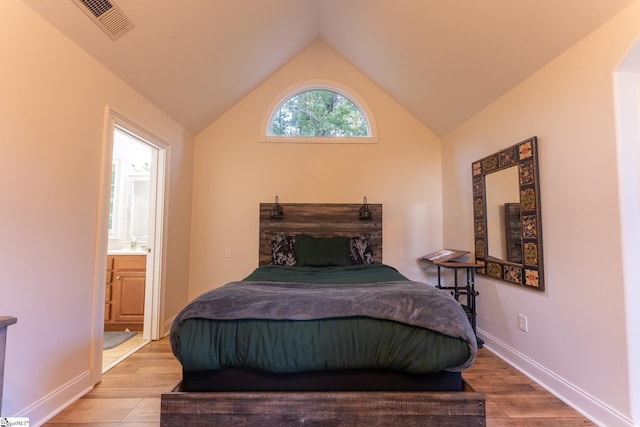 122 Fair Heaven Ct, Seneca, SC 29672 - bedroom with light wood-style floors, lofted ceiling, connected bathroom, and baseboards