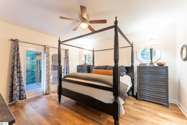 122 Fair Heaven Ct, Seneca, SC 29672 - bedroom featuring multiple windows, light wood-type flooring, ceiling fan, and baseboards