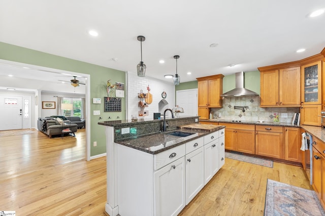700 Old Green Pond Rd, Anderson, SC 29625 - kitchen with a sink, wall chimney exhaust hood, light wood-style flooring, an island with sink, and recessed lighting