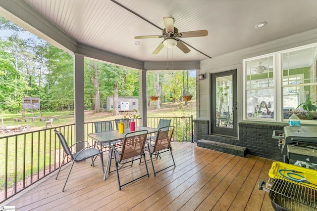 700 Old Green Pond Rd, Anderson, SC 29625 - deck with a ceiling fan, outdoor dining space, a lawn, and view of wooded area