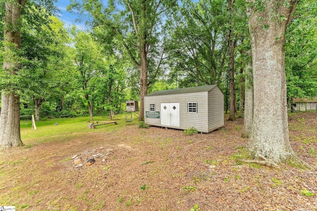 700 Old Green Pond Rd, Anderson, SC 29625 - view of grassy yard with a storage shed, an outdoor structure, and view of wooded area